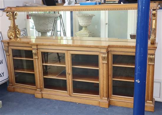 A Victorian parcel gilt burr maple mirror back breakfront side cabinet in the manner of Morel & Seddon W.244cm